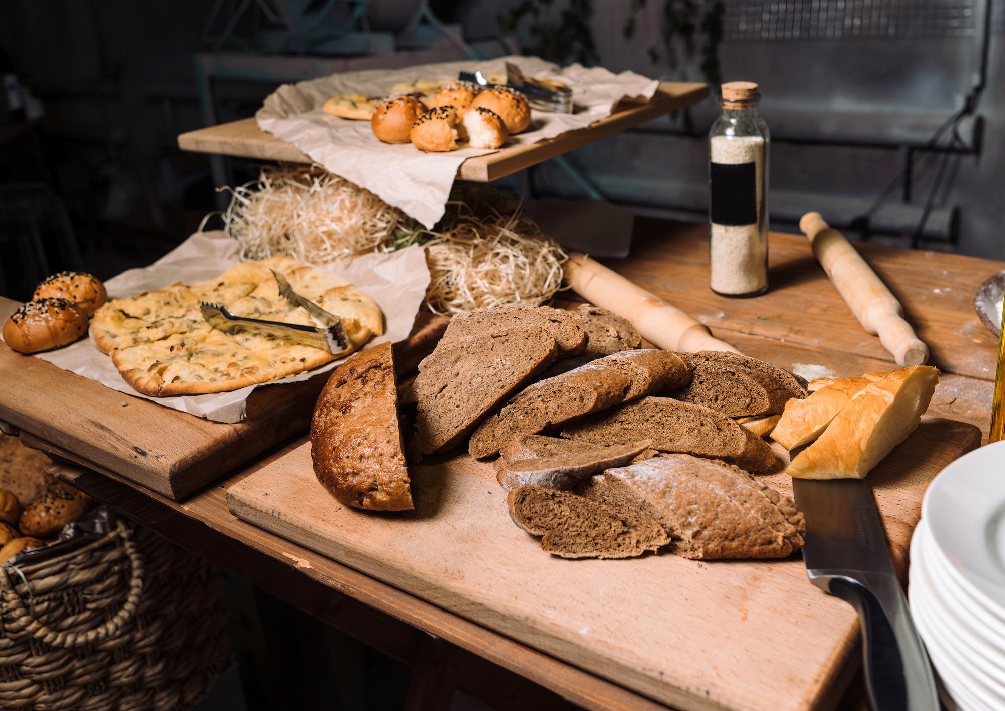 Artisanal breads and seasonal produce on a table